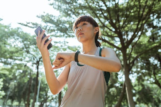 fitness tracker and smartphone on a desk